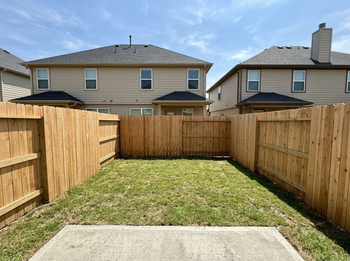 A small backyard with a plunge pool, before