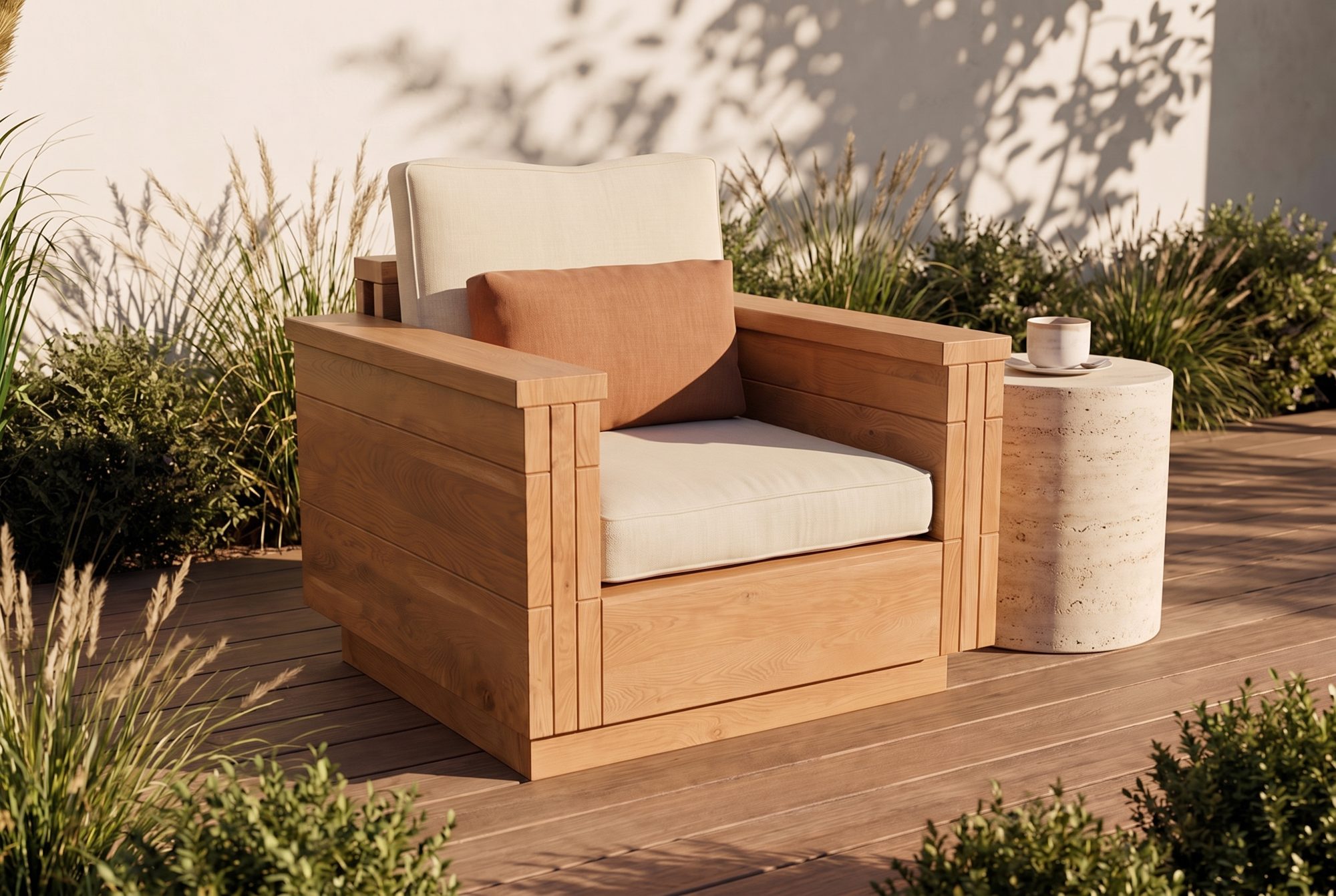The Block Lounge Chair in honey-oiled cedar with linen cushions on a sunlit deck